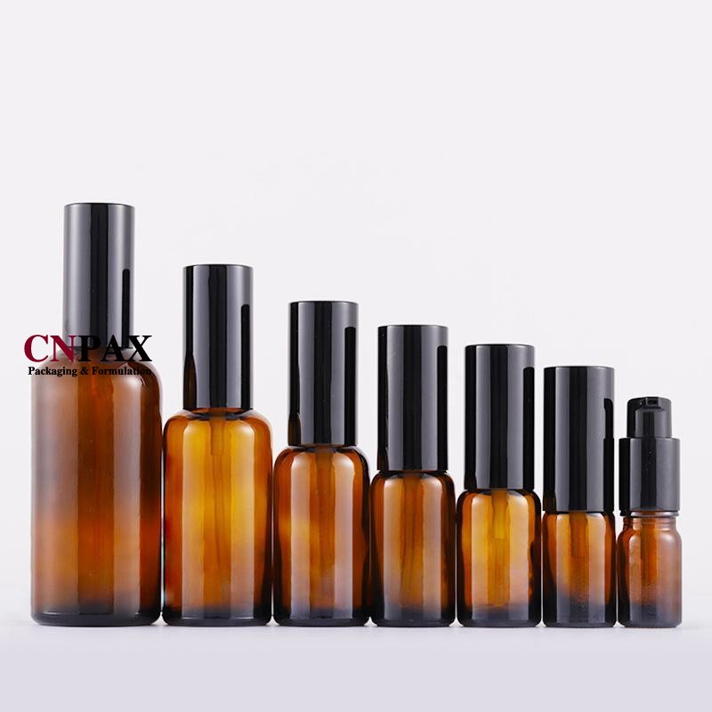 glass serum bottles with black treatment pump